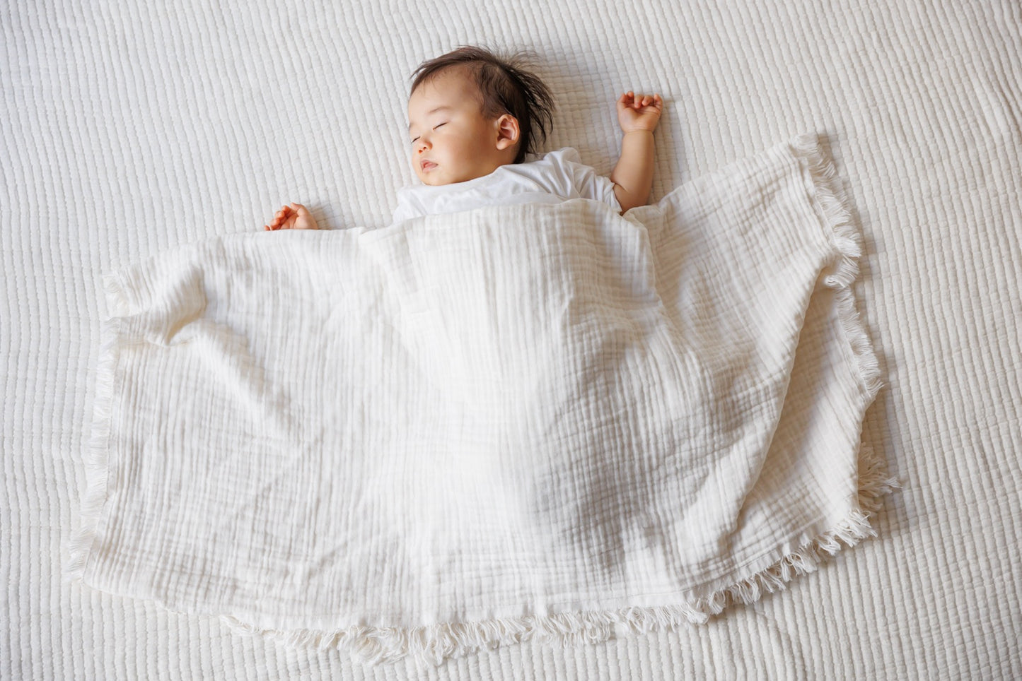 Front view of the 4-Layer Organic Cream Cotton Gauze Blanket, showing its crinkled texture and generous size.