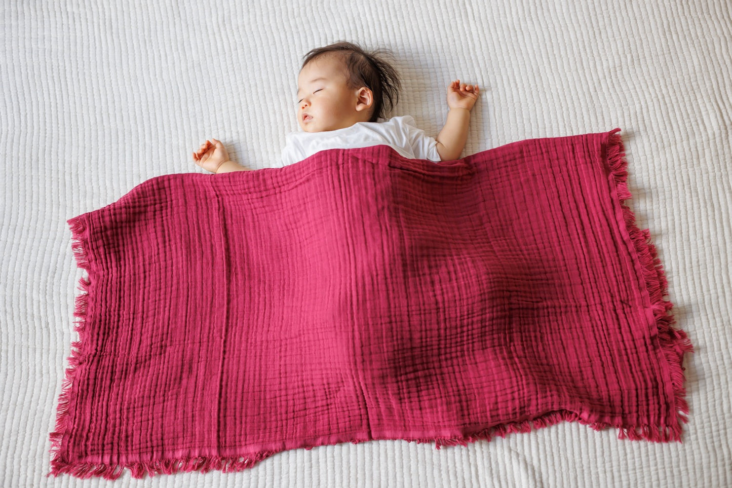 Versatile 4-layer cotton gauze muslin blanket in fuchsia for various uses